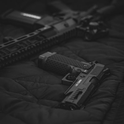 Photo by Bro Takes Photos black semi automatic pistol on black textile