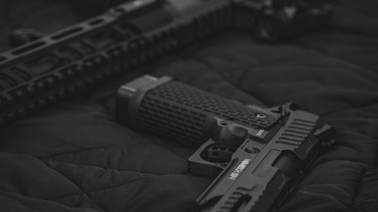 Photo by Bro Takes Photos black semi automatic pistol on black textile